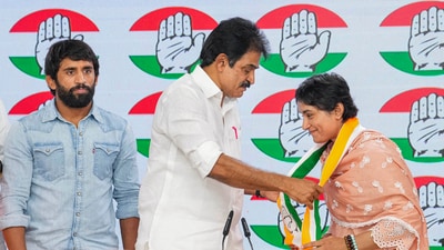 AICC General Secretary KC Venugopal felicitates wrestler Vinesh Phogat as she, along with Bajrang Punia, joins Congress at the party headquarters, in New Delhi, on Friday. (PTI) AICC General Secretary KC Venugopal felicitates wrestler Vinesh Phogat as she, along with Bajrang Punia, joins Congress at the party headquarters, in New Delhi, on Friday. (PTI)