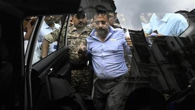 Sandip Ghosh, former principal of RG Kar Medical College and Hospital, being escorted by security officials in Kolkata. (Samir Jana/ HT Photo) Sandip Ghosh, former principal of RG Kar Medical College and Hospital, being escorted by security officials in Kolkata. (Samir Jana/ HT Photo)