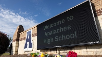 Flowers lay in front of the school sign outside of Apalachee High School on September 5, 2024 in Winder, Georgia.(Photo by Jessica McGowan / GETTY IMAGES NORTH AMERICA / Getty Images via AFP) (Getty Images via AFP) Flowers lay in front of the school sign outside of Apalachee High School on September 5, 2024 in Winder, Georgia.(Photo by Jessica McGowan / GETTY IMAGES NORTH AMERICA / Getty Images via AFP) (Getty Images via AFP)