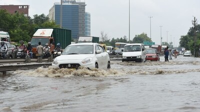 Visuals show commuters struggling through flooded areas as they travel for work or school, particularly in Baprola. Waterlogging has also affected the Delhi-Jaipur Expressway near Narsinghpur, as well as Sohna Road, Golf Course Extension Road, Basai, Hero Honda Chowk, Southern Peripheral Road (SPR), and Subhash Chowk. (Parveen Kumar/HT Photo) Visuals show commuters struggling through flooded areas as they travel for work or school, particularly in Baprola. Waterlogging has also affected the Delhi-Jaipur Expressway near Narsinghpur, as well as Sohna Road, Golf Course Extension Road, Basai, Hero Honda Chowk, Southern Peripheral Road (SPR), and Subhash Chowk. (Parveen Kumar/HT Photo)