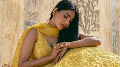 This lehenga, in another shade of yellow, paired with gold ear cuffs also make her look right out of an Indian romantic movie. This lehenga, in another shade of yellow, paired with gold ear cuffs also make her look right out of an Indian romantic movie.