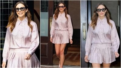 Elizabeth Olsen looked refreshing as she embraced the co-ord style statement in a polka dot printed blush pink silk blouse and a pleated mini skirt. She styled the ensemble with sunglasses, centre-parted blowout locks, and minimal glam. (Instagram) Elizabeth Olsen looked refreshing as she embraced the co-ord style statement in a polka dot printed blush pink silk blouse and a pleated mini skirt. She styled the ensemble with sunglasses, centre-parted blowout locks, and minimal glam. (Instagram)