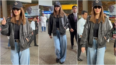 Kriti Sanon was photographed at the airport today, rocking an uber-cool ensemble featuring a black leather jacket and matching crewneck tee with high-waisted baggy boyfriend jeans. A baseball cap, sunglasses, and sneakers completed her look. (HT Photo/Varinder Chawla) Kriti Sanon was photographed at the airport today, rocking an uber-cool ensemble featuring a black leather jacket and matching crewneck tee with high-waisted baggy boyfriend jeans. A baseball cap, sunglasses, and sneakers completed her look. (HT Photo/Varinder Chawla)