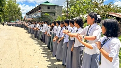 School students take part in a human chain rally to protest against the recent drone and gun attacks in Manipur's Koutruk and Senjam Chirang that resulted in two civilian deaths and 12 injuries. (PTI) School students take part in a human chain rally to protest against the recent drone and gun attacks in Manipur's Koutruk and Senjam Chirang that resulted in two civilian deaths and 12 injuries. (PTI)