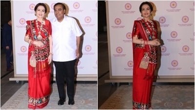 Nita Ambani embraced traditions in a red Patola silk saree for attending an event at NMACC. She wore the nine yards in traditional Gujarati draping style. A matching silk blouse, embellished potli bag, gold platform heels, a necklace, earrings, and statement rings completed the look. (HT Photo/Varinder Chawla) Nita Ambani embraced traditions in a red Patola silk saree for attending an event at NMACC. She wore the nine yards in traditional Gujarati draping style. A matching silk blouse, embellished potli bag, gold platform heels, a necklace, earrings, and statement rings completed the look. (HT Photo/Varinder Chawla)