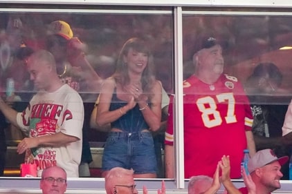 Taylor Swift cheers next to George Kelce during the first half of the game between the Kansas City Chiefs and Baltimore Ravens. (USA TODAY Sports via Reuters Con)