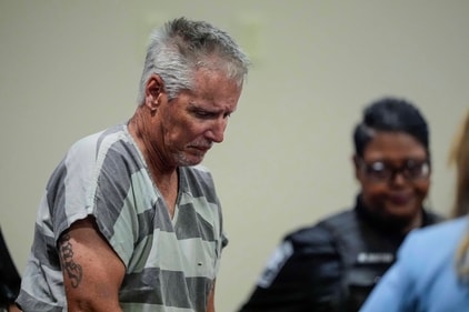 Colin Gray, 54, the father of Apalachee High School shooting suspect Colt Gray, 14, enters the Barrow County courthouse for his first appearance, on September 6, 2024, in Winder, Georgia. (Getty Images via AFP) Colin Gray, 54, the father of Apalachee High School shooting suspect Colt Gray, 14, enters the Barrow County courthouse for his first appearance, on September 6, 2024, in Winder, Georgia. (Getty Images via AFP)