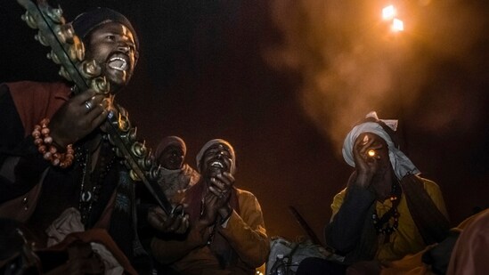 A group of euphoric ascetics, pilgrims to Gangasagar, evidently in search of salvation.(Photo by Sandipan Mukherjee)
