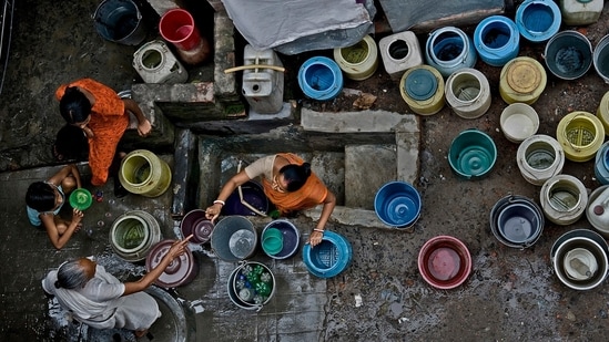 Two women contending over a spot in a long queue for tap water. The image depicts the daily struggle of people in many parts of the country, suffering from acute water scarcity.&nbsp;( Photo by Sandipan Mukherjee)