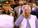 Nobel laureate Muhammad Yunus salutes to the attendees upon arrival at the Bangabhaban to take oath as the head of the interim government in Dhaka, Bangladesh.