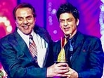 Dharmendra and Shah Rukh Khan pose together in this old photo. Dharmendra and Shah Rukh Khan pose together in this old photo.