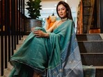 Sukhmani Sadana in an elegant yet subtle turquoise colored saree