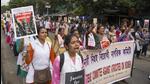 Health workers and others take part in a protest rally over the alleged sexual assault and murder of a trainee doctor in Kolkata on Saturday. (PTI)