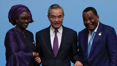 China's foreign minister Wang Yi, center, holds hands with his counterparts, Senegal's Yassine Fall, left, and Congo's Jean-Claude Gakosso after a joint press conference at the China Africa Forum in Beijing, Thursday, Sept. 5, 2024. AP/PTI(AP09_05_2024_000418A) (AP) China's foreign minister Wang Yi, center, holds hands with his counterparts, Senegal's Yassine Fall, left, and Congo's Jean-Claude Gakosso after a joint press conference at the China Africa Forum in Beijing, Thursday, Sept. 5, 2024. AP/PTI(AP09_05_2024_000418A) (AP)
