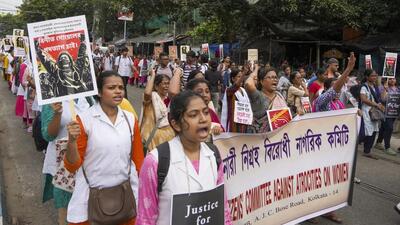 Health workers and others take part in a protest rally over the alleged sexual assault and murder of a trainee doctor in Kolkata on Saturday. (PTI) Health workers and others take part in a protest rally over the alleged sexual assault and murder of a trainee doctor in Kolkata on Saturday. (PTI)