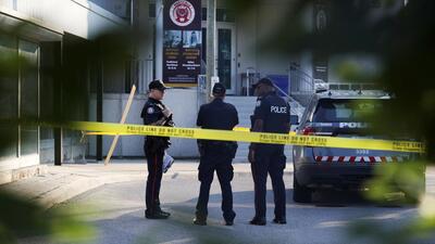 Police officers stand at the scene of a deadly shooting at an office building in the Don Mills neighbourhood of Toronto, Ontario, Canada, on June 17. (REUTERS) Police officers stand at the scene of a deadly shooting at an office building in the Don Mills neighbourhood of Toronto, Ontario, Canada, on June 17. (REUTERS)