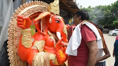 Shrawan Prajapati giving final touches to the idol Shrawan Prajapati giving final touches to the idol