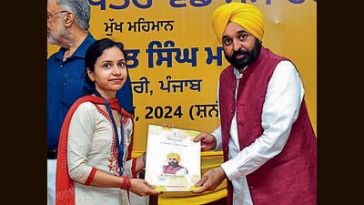 Punjab chief minister Bhagwant Mann hands over an appointment letter to a candidate during a program in Chandigarh on Saturday. (Photo X) Punjab chief minister Bhagwant Mann hands over an appointment letter to a candidate during a program in Chandigarh on Saturday. (Photo X)