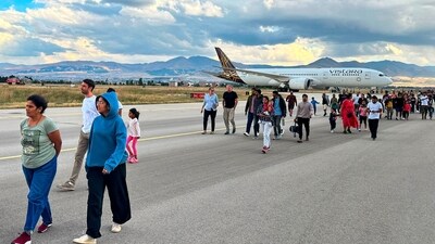 Passengers of the Vistara flight VTI027 from Mumbai to Frankfurt walk along the tarmac as they leave the plane at the Erzurum airport in eastern Turkey, Friday,. The Vistara airline flight made a forced landing in Turkey on Friday following a bomb threat, Turkish officials said. (AP) Passengers of the Vistara flight VTI027 from Mumbai to Frankfurt walk along the tarmac as they leave the plane at the Erzurum airport in eastern Turkey, Friday,. The Vistara airline flight made a forced landing in Turkey on Friday following a bomb threat, Turkish officials said. (AP)