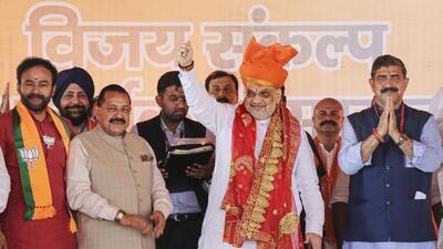 Union home minister Amit Shah during a BJP workers’ meeting in Jammu on Saturday. Minister of state Jitendra Singh is also seen. (PTI Photo)