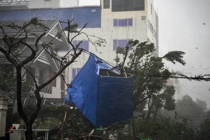 The debris of a destroyed fence is tangled in trees after Super Typhoon Yagi hit Hai Phong on September 7, 2024. (AFP) The debris of a destroyed fence is tangled in trees after Super Typhoon Yagi hit Hai Phong on September 7, 2024. (AFP)