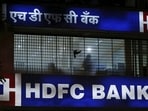 A bird flies past a window of a HDFC Bank branch office in Mumbai, India, October 21, 2015. (Shailesh Andrade/Reuters)