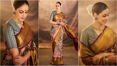 Genelia D'Souza exudes festive glamour in an ethereal saree. The elegant six yards is adorned with intricate mythological prints and golden borders. Paired with a contrasting striped blouse and traditional jewellery, she looks stunning. (Instagram) Genelia D'Souza exudes festive glamour in an ethereal saree. The elegant six yards is adorned with intricate mythological prints and golden borders. Paired with a contrasting striped blouse and traditional jewellery, she looks stunning. (Instagram)