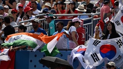 South Korea and India fans wave their national flags during the archery mixed team elimination round during the Paris 2024 Olympic Games at the Esplanade des Invalides in Paris on August 2, 2024. (Photo by Punit PARANJPE / AFP) (AFP) South Korea and India fans wave their national flags during the archery mixed team elimination round during the Paris 2024 Olympic Games at the Esplanade des Invalides in Paris on August 2, 2024. (Photo by Punit PARANJPE / AFP) (AFP)