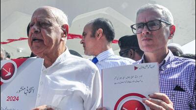 NC president Farooq Abdullah and V-P Omar Abdullah with party manifesto during an event held to mark the 42nd death anniversary of party founder Sheikh Abdullah at Hazratbal. (ANI) NC president Farooq Abdullah and V-P Omar Abdullah with party manifesto during an event held to mark the 42nd death anniversary of party founder Sheikh Abdullah at Hazratbal. (ANI)