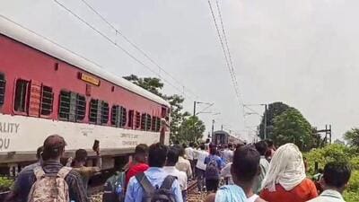 People gather after the Magadh Express train split into two parts after an accident in Bihar’s Buxar on Sunday. (PTI) People gather after the Magadh Express train split into two parts after an accident in Bihar’s Buxar on Sunday. (PTI)