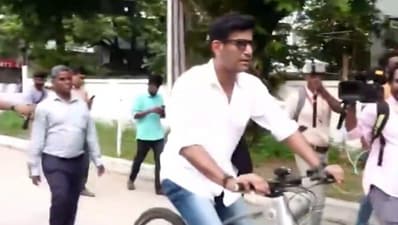 Vishal arrives on a bicycle to attend 68th South Indian Artist Association meeting. (PTI) Vishal arrives on a bicycle to attend 68th South Indian Artist Association meeting. (PTI)