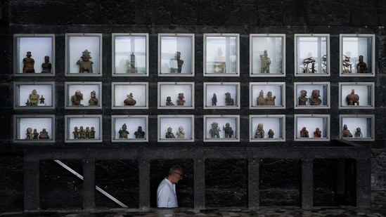 Pre-hispanic ceramics are displayed in glass front niches in the Anahuacalli Museum in Mexico City. (AP Photo/Eduardo Verdugo)