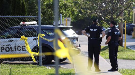 Police officers stand at the scene of a shooting at an office building in the Don Mills neighbourhood of Toronto, Ontario, Canada. (Photograph for representative purpose only) (REUTERS)