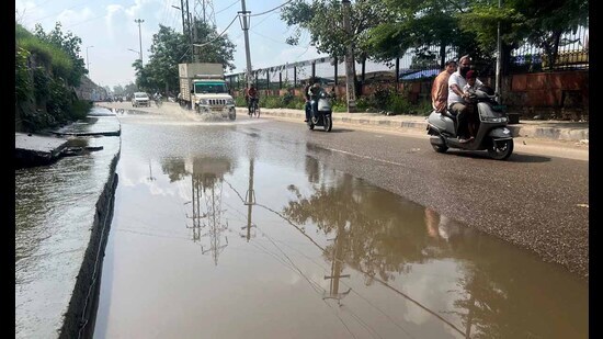 Rainwater accumulated on NHAI constructed lane near Dana Mandi in Ludhiana on Sunday. (Manish/Hindustan Times)