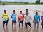 Bhagwan Jambhale (centre, hands spread), a local farmer who owns about 10 acres of land, said farmlands in the area are inundated with blackish water