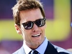 Sep 8, 2024; Cleveland, Ohio, USA; Fox Sports broadcaster Tom Brady talks on the field before the game between the Cleveland Browns and the Dallas Cowboys at Huntington Bank Field. Mandatory Credit: Ken Blaze-Imagn Images