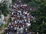 Medical professionals and students take part in a protest rally against the rape and murder of a doctor in Kolkata on August 21, 2024 (Photo by DIBYANGSHU SARKAR / AFP)