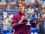 Sep 8, 2024; Flushing, NY, USA; Jannik Sinner (ITA) celebrates with the trophy after defeating Taylor Fritz (USA) in the men’s singles final of the 2024 U.S. Open.