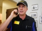 Walt Ehmer, president and CEO of Waffle House, speaks on the phone after landing at the Wilmington airport with an emergency response team in Wilmington, N.C., Sept. 17, 2018. Walt Ehmer, president and CEO of Waffle House, speaks on the phone after landing at the Wilmington airport with an emergency response team in Wilmington, N.C., Sept. 17, 2018.