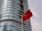 The Chinese flag flies outside a commercial building in Shenzhen, China, on Tuesday, July 2, 2024. (Raul Ariano/Bloomberg)