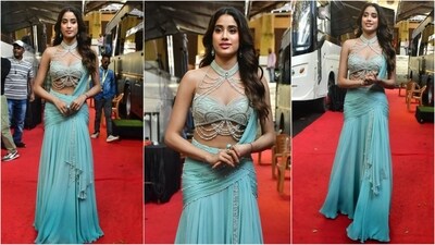 Janhvi Kapoor rocked the apsaracore trend with her latest look, donning a blue lehenga saree paired with a pearl-studded blouse and a flowy skirt, exuding elegance and grace. (HT photo/VarinderChawla)