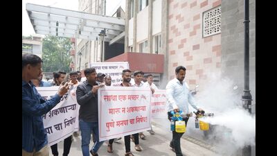 Bharatiya Janata Party (BJP) leader Amol Balwadkar on Monday used a fogging machine to disinfect the Pune Municipal Corporation (PMC) headquarters campus. (HT PHOTO)