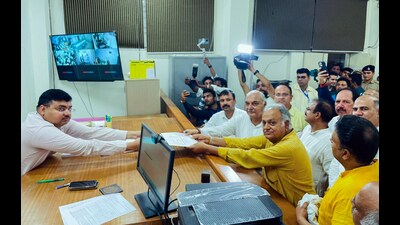 Congress candidate from Ganaur assembly segment Kuldeep Sharma, accompanied by party leader Bhupinder Singh Hooda, files his nomination ahead of Haryana assembly elections in Ganaur on Monday. (ANI) Congress candidate from Ganaur assembly segment Kuldeep Sharma, accompanied by party leader Bhupinder Singh Hooda, files his nomination ahead of Haryana assembly elections in Ganaur on Monday. (ANI)