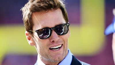 Sep 8, 2024; Cleveland, Ohio, USA; Fox Sports broadcaster Tom Brady talks on the field before the game between the Cleveland Browns and the Dallas Cowboys at Huntington Bank Field. Mandatory Credit: Ken Blaze-Imagn Images (USA TODAY Sports via Reuters Con)