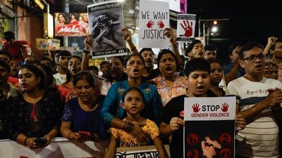 People chant slogans as they participate in a protest condemning and marking one month since the rape and murder of a trainee medic at a government-run hospital in Kolkata. (Reuters)