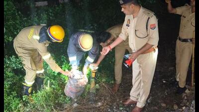 Police and fire services personnel inspect an LPG cylinder at the site. (PTI Photo) Police and fire services personnel inspect an LPG cylinder at the site. (PTI Photo)