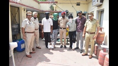 The accused in police custody in Jalandhar on Monday. (HT photo)