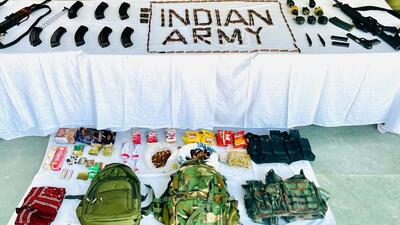 Weapons including two AK-47s and a pistol, ammo recovered from the encounter site. (PTI) Weapons including two AK-47s and a pistol, ammo recovered from the encounter site. (PTI)