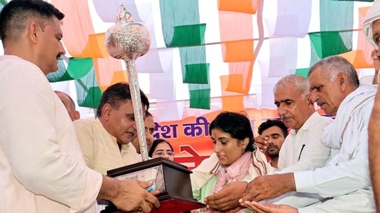 Khap representatives felicitating wrestler-turned-politician Vinesh Phogat in Jind’s Julana on Sunday. (Manoj Dhaka/HT)