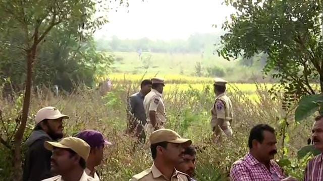 Police officials at the spot where the accused in the rape and murder of the woman veterinarian were killed in an encounter, in Hyderabad. (ANI photo) Police officials at the spot where the accused in the rape and murder of the woman veterinarian were killed in an encounter, in Hyderabad. (ANI photo)